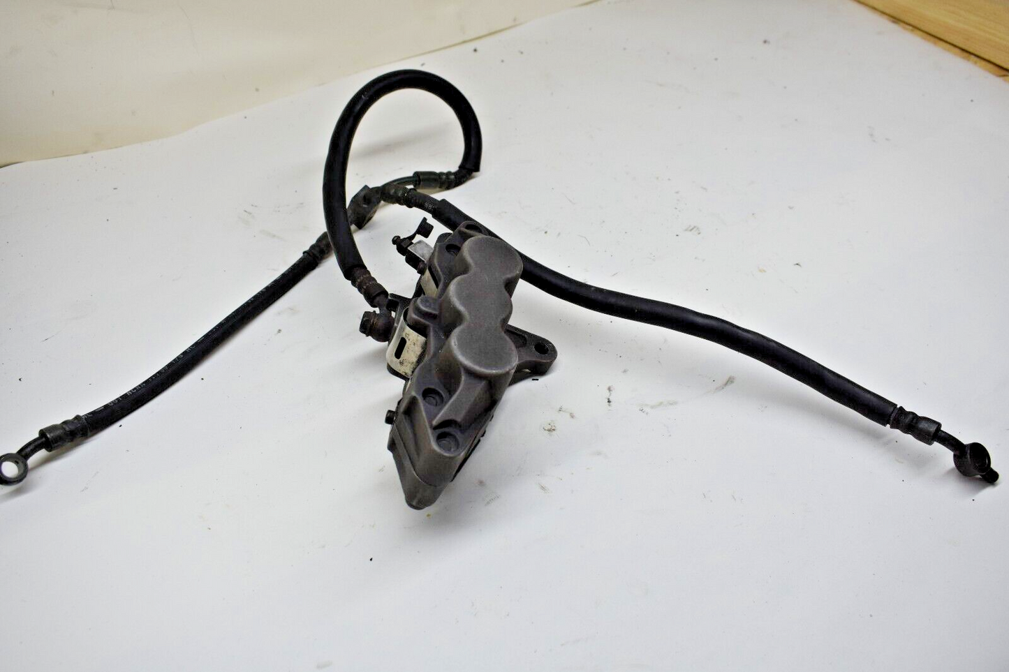 Kawasaki Ninja ZX6R TOKICO Front left brake caliper with hoses SET 430411820GZ
